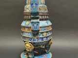 an image of a blue and gold vase with a lion on it