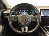 the interior of a car with a steering wheel and dashboard controls