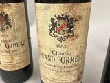 three bottles of wine sitting next to each other on a table