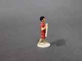 a small figurine of a woman holding a baseball bat