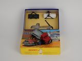 a box with a toy motorcycle and a car in it