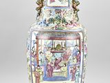 a large vase with a painting on it sitting on a table