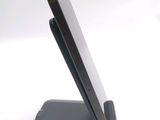 a cell phone on a stand on a white surface