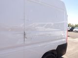 a white van that is parked in a parking lot