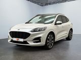 Une Ford Kuga blanche est garée dans une grande pièce