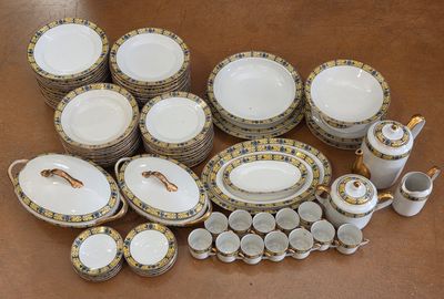 many different types of porcelain dishes and cups on the table