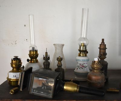 many different types of antique lamps on a table