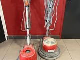 two vacuums that are sitting on the floor next to each other