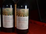 three bottles of wine sitting on top of a table next to each other