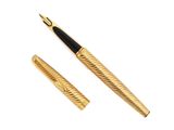 a gold pen and a black pen sitting on top of a white surface