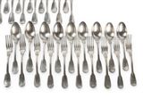 a lot of silver spoons and forks on a white surface