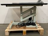 the table is on a pallet with a power cord plugged into it