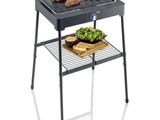 an image of a barbecue grill with meat and vegetables on it
