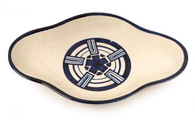 a blue and white plate with a design on it