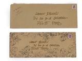 an old envelope with a stamp on it sitting next to a piece of paper