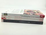 three books stacked on top of each other on a table