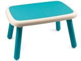 une petite table avec un plateau bleu sur fond blanc