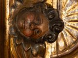 a wooden carving of a man with a crown on it ' s head