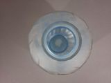 a bottle of water sitting on a white surface