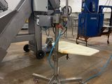 an image of a machine that is working on a piece of wood