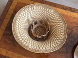 a wicker basket sitting on top of a wooden table