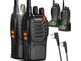 two walkie talkies with a charger and a charger on a white background