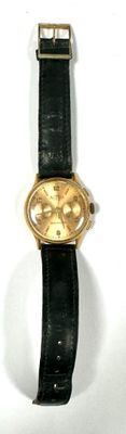 a watch that is sitting on a white surface