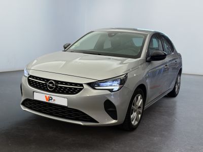 the front view of a silver car in a white room