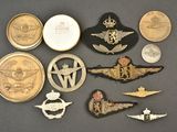 several different types of military badges are displayed on a table