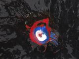a red and blue object in the middle of a black background