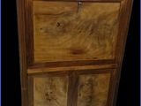 an image of a wooden cabinet with a marble top