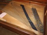 a piano that has a bunch of strings on it