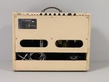 a guitar amplifier sitting on top of a white table