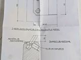 diagram of a piece of paper with a drawing of a machine on it