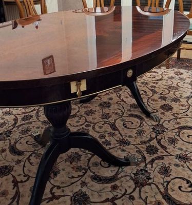 a dining room table and chairs in a room