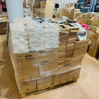 a large amount of boxes stacked on top of each other in a warehouse