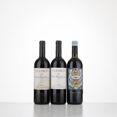 three bottles of wine sitting on top of a table next to each other