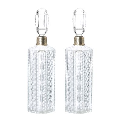 deux bouteilles en verre transparent avec un bouchon doré, sur fond blanc