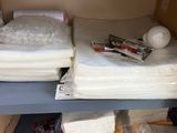 two beds that are sitting on a shelf in a room