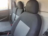 four seats in the back of a van with a window open