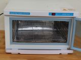 an electric oven with a door open on a table