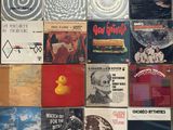 many different types of vinyl records on the wall