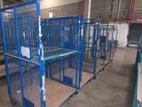 many cages that are in a building with a lot of them