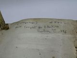an open book with writing on it sitting on top of a table