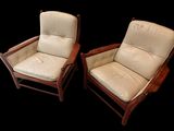 paire de fauteuils de salon de style « mid-century modern » avec assises rembourrées en cuir