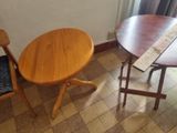 two chairs and a table in the corner of a room