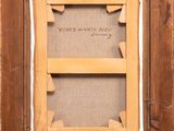 an old wooden frame with a picture hanging on the wall