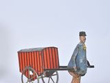toy figurines of a man pulling a wagon with a horse and buggy