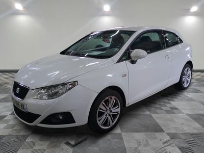 a picture of a white car on a checkered floor