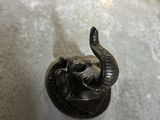 a metal object with an elephant head on top of it